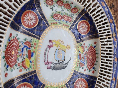 Lot 83 - A CHINESE FAMILLE ROSE ARMORIAL STAND AND MEAT DISH.