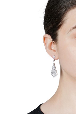 Lot 65 - A pair of diamond pendent earrings