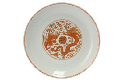 Lot 662 - A CHINESE IRON-RED 'DRAGON AND PHOENIX' DISH.