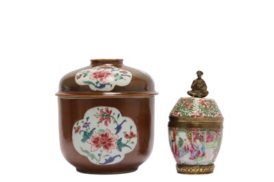 Lot 268 - TWO CHINESE FAMILLE ROSE JARS AND COVERS.