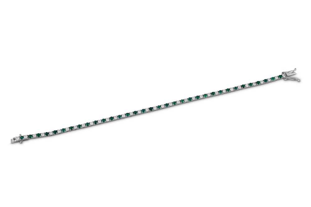 Lot 170 - An emerald and diamond line bracelet