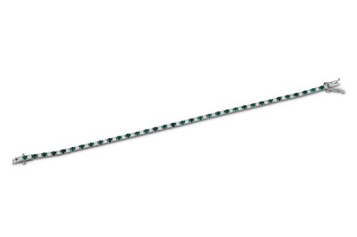 Lot 170 - An emerald and diamond line bracelet