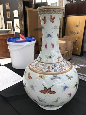 Lot 587 - A CHINESE FAMILLE ROSE 'BUTTERFLIES' BOTTLE VASE.