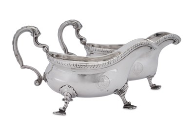 Lot 509 - A near pair of George II/III sterling silver sauceboats, one London 1764 by William Grundy