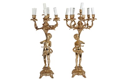 Lot 81 - A PAIR OF GILT METAL SEVEN LIGHT CANDELABRA IN LOUIS XV STYLE