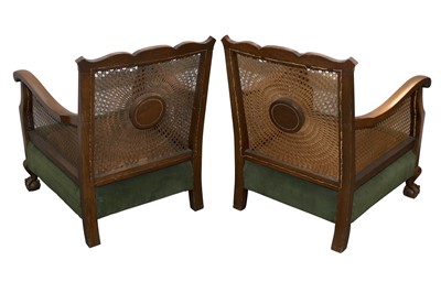 Lot 134 - A PAIR OF STAINED BEECH BERGERE CHAIRS