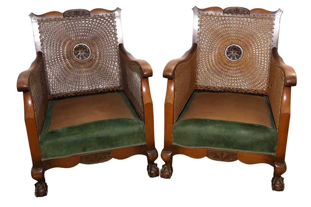 Lot 134 - A PAIR OF STAINED BEECH BERGERE CHAIRS