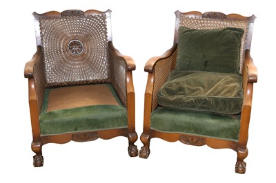 Lot 134 - A PAIR OF STAINED BEECH BERGERE CHAIRS