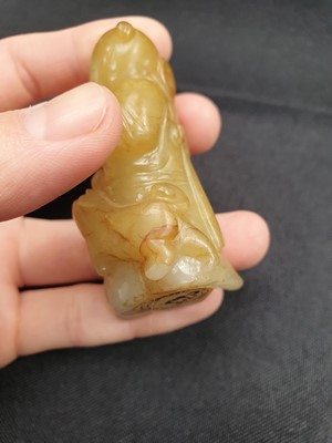 Lot 129 - A CHINESE YELLOW JADE CARVING OF A BOY.