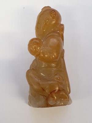 Lot 129 - A CHINESE YELLOW JADE CARVING OF A BOY.