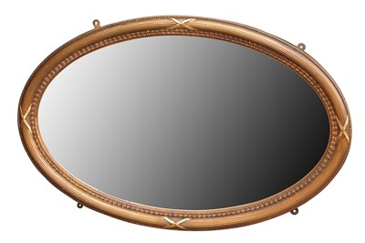 Lot 96 - A NEO-CLASSICAL STYLE OVAL GILT FRAMED MIRROR
