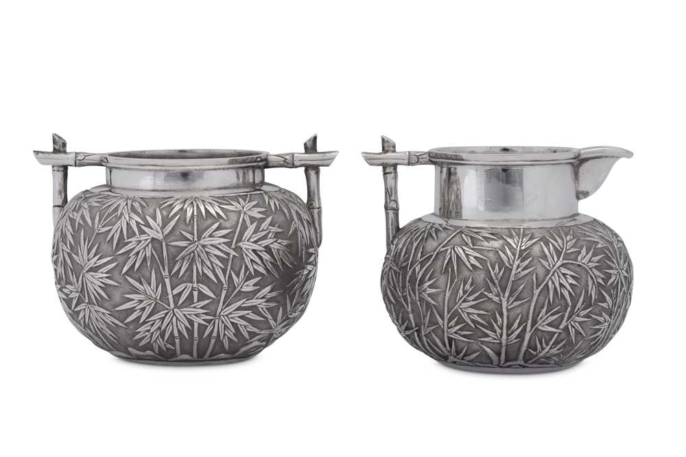 Lot 222 - An early 20th century Chinese Export silver milk jug and sugar bowl, Canton circa 1900 retailed by Wang Hing