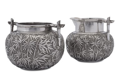 Lot 222 - An early 20th century Chinese Export silver milk jug and sugar bowl, Canton circa 1900 retailed by Wang Hing