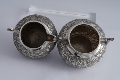 Lot 222 - An early 20th century Chinese Export silver milk jug and sugar bowl, Canton circa 1900 retailed by Wang Hing