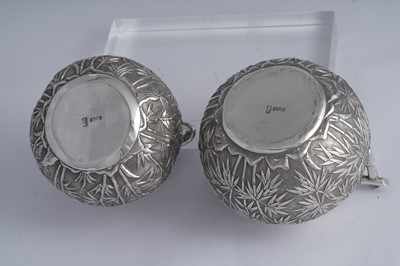 Lot 222 - An early 20th century Chinese Export silver milk jug and sugar bowl, Canton circa 1900 retailed by Wang Hing