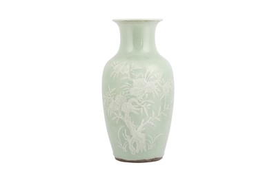 Lot 122 - A CHINESE SLIP-DECORATED CELADON VASE.