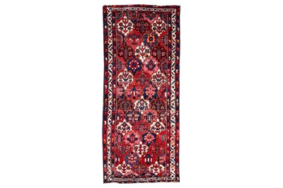 Lot 428 - A BAKHTIARI LONG RUG