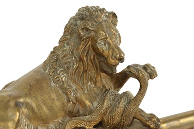 Lot 137 - A MID 19TH CENTURY FRENCH GILT BRONZE ADJUSTABLE FENDER DECORATED WITH LIONS