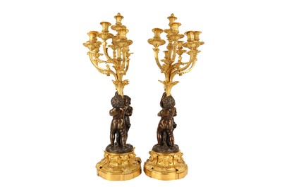 Lot 65 - A VERY LARGE PAIR OF MID 19TH CENTURY GILT AND PATINATED BRONZE FIGURAL CANDELABRA CIRCA 1860
