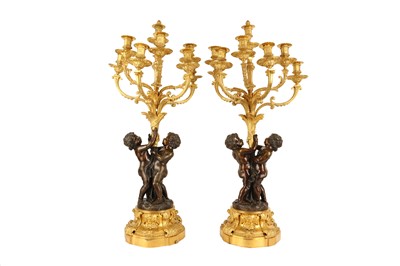 Lot 65 - A VERY LARGE PAIR OF MID 19TH CENTURY GILT AND PATINATED BRONZE FIGURAL CANDELABRA CIRCA 1860