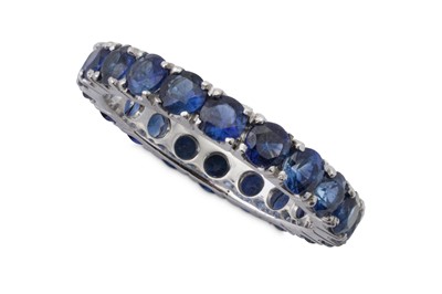 Lot 32 - A sapphire eternity ring