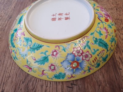 Lot 674 - A CHINESE FAMILLE ROSE YELLOW-GROUND DISH.