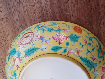 Lot 674 - A CHINESE FAMILLE ROSE YELLOW-GROUND DISH.