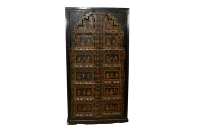 Lot 48 - A PAIR OF INDIAN WINDOW SHUTTERS INCORPORATED INTO A LATER RAJASTHANI CUPBOARD