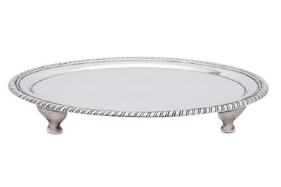 Lot 171 - An early 19th century Indian Colonial silver teapot stand, Madras circa 1810 by Robert Gordon II (active 1802-1818)