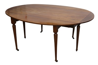 Lot 137 - A CONTINENTAL FRUITWOOD DROP LEAF DINING TABLE