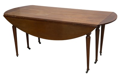Lot 137 - A CONTINENTAL FRUITWOOD DROP LEAF DINING TABLE