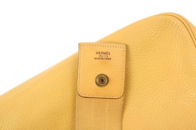 Lot 148 - Hermès Pale Yellow Clemence Tsako Shoulder Bag