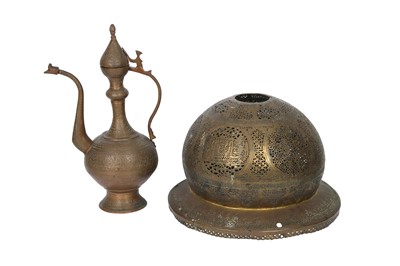 Lot 295 - A MAMLUK-REVIVAL OPENWORK COPPER LANTERN COVER AND AN ENGRAVED COPPER EWER