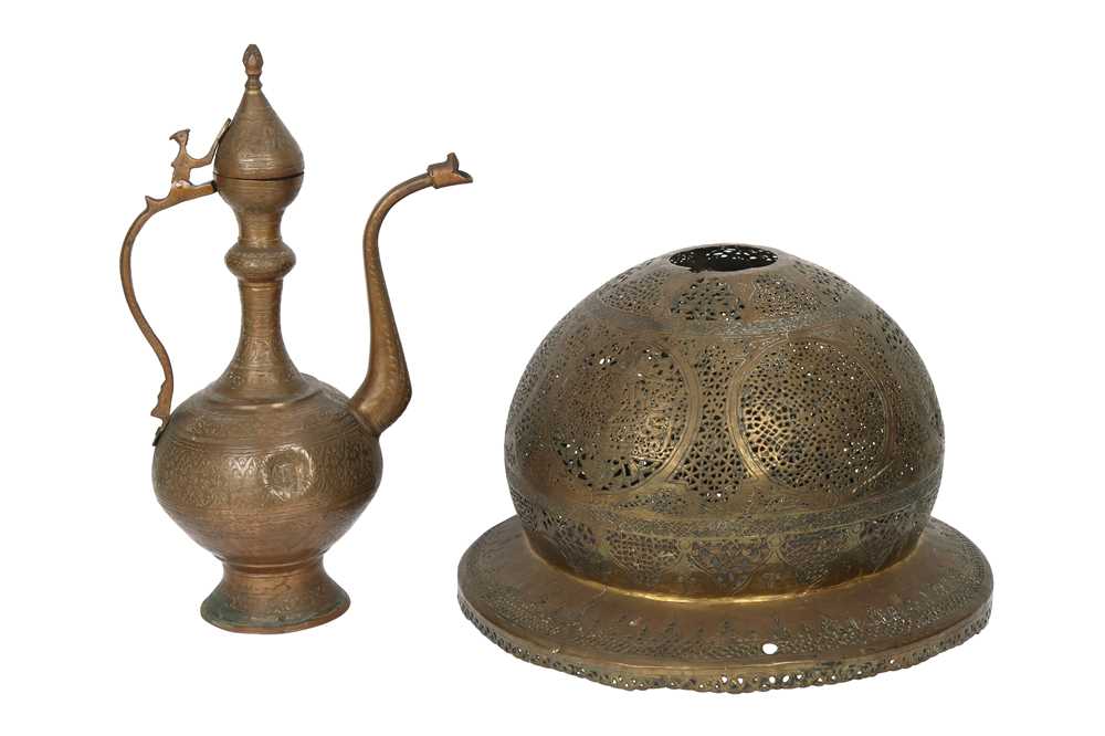 Lot 295 - A MAMLUK-REVIVAL OPENWORK COPPER LANTERN COVER AND AN ENGRAVED COPPER EWER