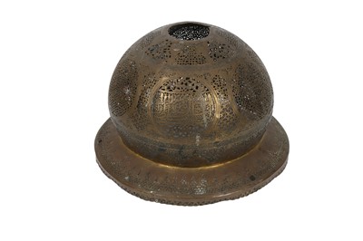 Lot 295 - A MAMLUK-REVIVAL OPENWORK COPPER LANTERN COVER AND AN ENGRAVED COPPER EWER