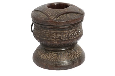 Lot 294 - A CARVED WOOD COFFEE GROUNDER WITH PSEUDO-CALLIGRAPHIC BAND
