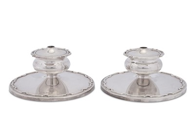 Lot 405 - A pair of Elizabeth II combination dwarf candlesticks and tapersticks, Sheffield 1957 by Walker and Hall