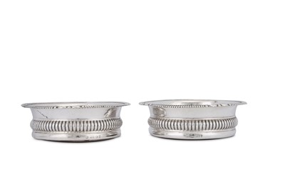 Lot 495 - A pair of George IV sterling silver wine coasters, Sheffield 1828 by John and Thomas Settle