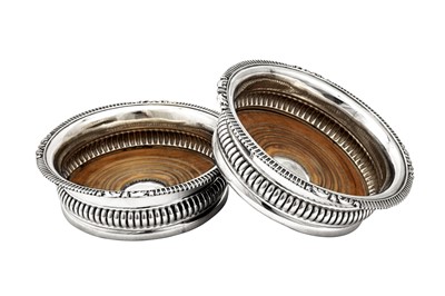 Lot 641 - A pair of George IV sterling silver wine coasters, Sheffield 1828 by John and Thomas Settle