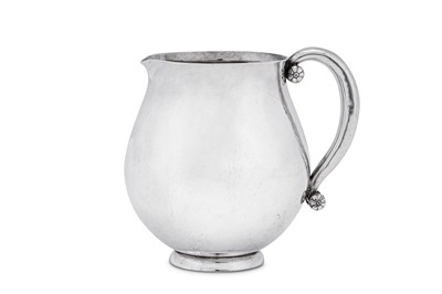 Lot 150 - An early 20th century Danish sterling silver cream jug, Copenhagen by Georg Jensen, import marks for London 1939