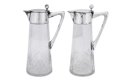 Lot 92 - A pair of early 20th century German 800 standard silver mounted claret jugs, Schwäbisch Gmünd circa 1910 by Seybold & Hirschhauer