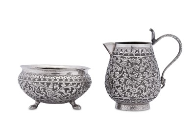 Lot 184 - An early 20th century Anglo – Indian unmarked silver sugar bowl and milk jug, Lucknow circa 1920
