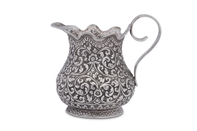 Lot 198 - An early 20th century Anglo – Indian unmarked silver cream or milk jug, Cutch circa 1920