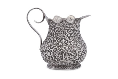 Lot 198 - An early 20th century Anglo – Indian unmarked silver cream or milk jug, Cutch circa 1920