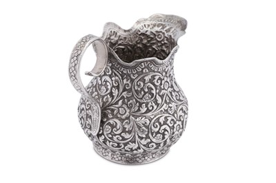 Lot 198 - An early 20th century Anglo – Indian unmarked silver cream or milk jug, Cutch circa 1920