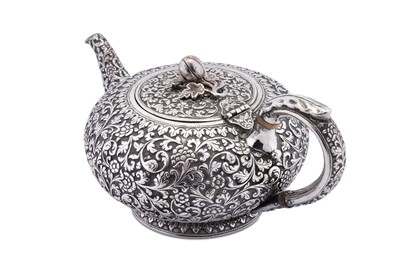 Lot 207 - A rare mid-19th century Anglo – Indian silver teapot, Cutch, Bhuj, circa 1860 by Oomersi Mawji (active 1860-90)