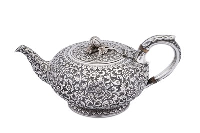 Lot 207 - A rare mid-19th century Anglo – Indian silver teapot, Cutch, Bhuj, circa 1860 by Oomersi Mawji (active 1860-90)