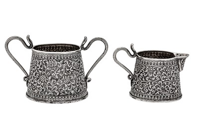 Lot 201 - A late 19th century Anglo – Indian unmarked silver milk jug and sugar bowl, Cutch circa 1880