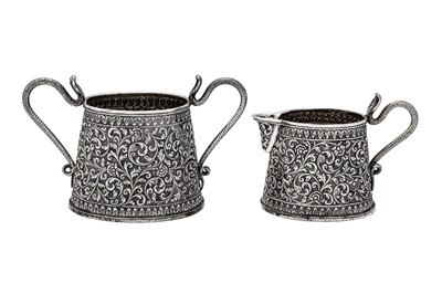 Lot 201 - A late 19th century Anglo – Indian unmarked silver milk jug and sugar bowl, Cutch circa 1880