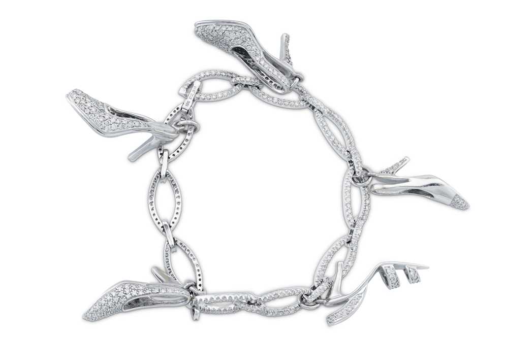 Lot 81 - A diamond charm bracelet